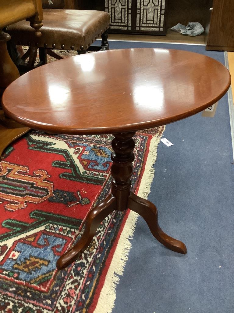 A Victorian oval mahogany occasional table, on pedestal support, width 55cm depth 39cm height 56cm